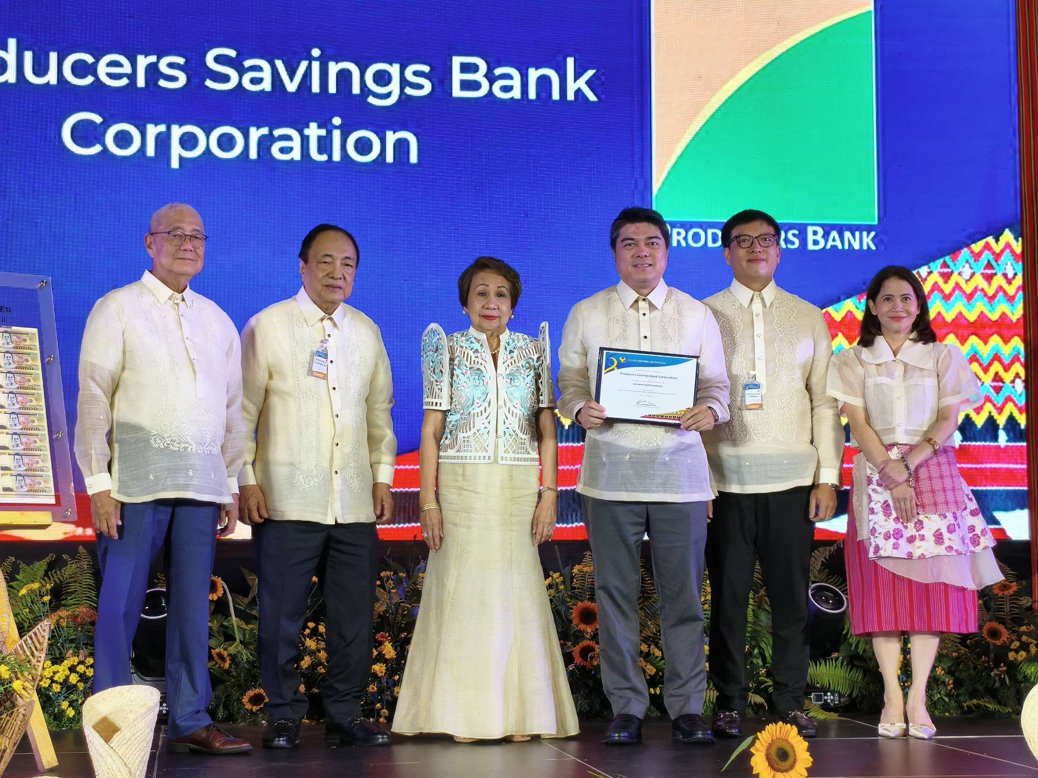 Producers Savings Bank Corporation officials receiving the 2026 Outstanding BSP Stakeholder recognition with BSP Governor Eli M. Remolona, Jr. and Deputy Governor Bernadette Romulo-Puyat